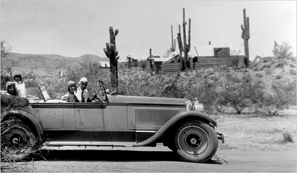 Wright at the wheel of a Packard at an Arizona camp in 1929. Image from Frank Lloyd Wright Foundation.